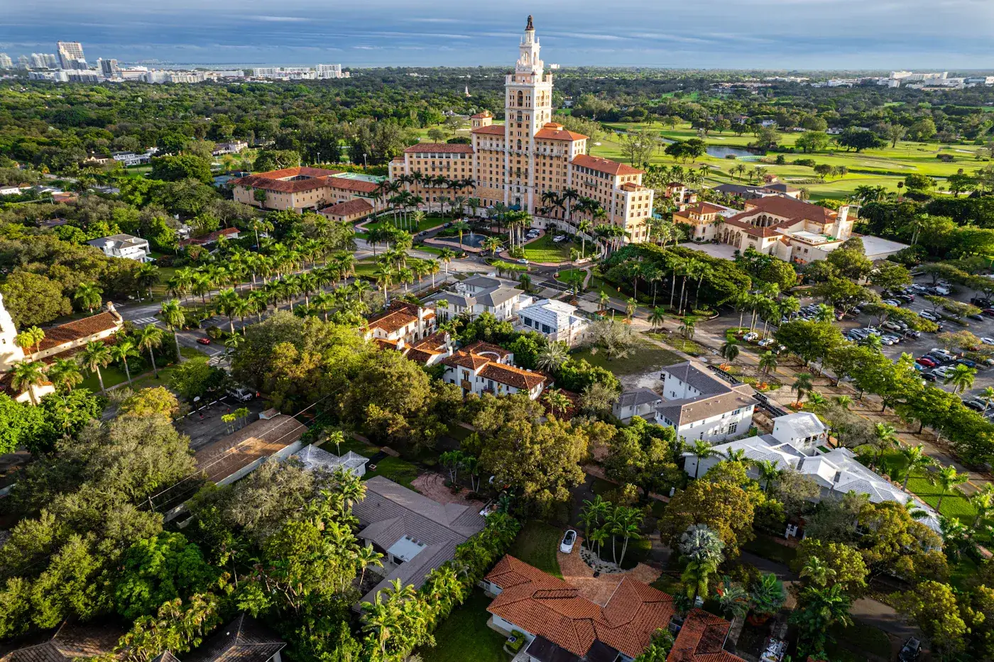 Coral Gables rooftops under the tree canopy, looking toward the Biltmore, Miami